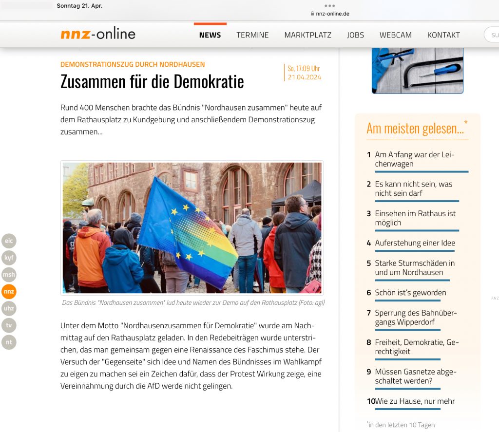 Screenshot nnz vom 21.04.2024 - Ausschnitt aus der Seite, zu sehen ist ein Foto, welches Demonstrationsteilnehmende mit einer Europa-Regenbogen-Fahne zeigt